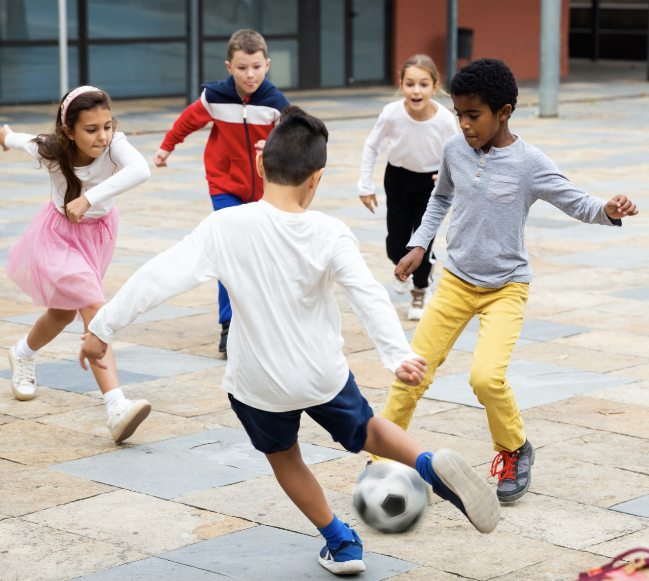 Children participating in an active play activity during recess at school.